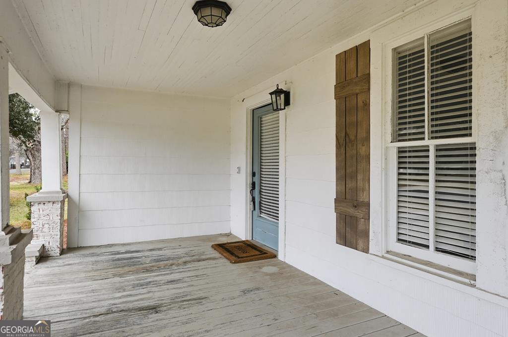611 West 3rd Street Ocilla, GA 31774 - Photo 43 of 53 a view of an empty room with wooden floor and a window