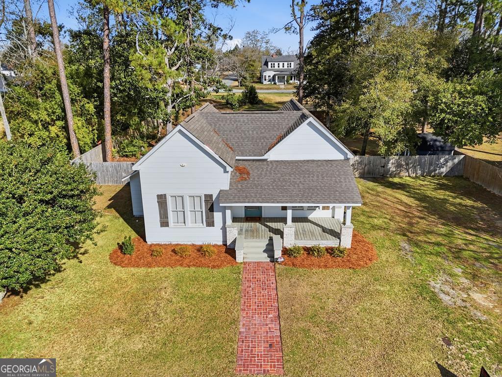 611 West 3rd Street Ocilla, GA 31774 - Photo 51 of 53 a house with trees in the background