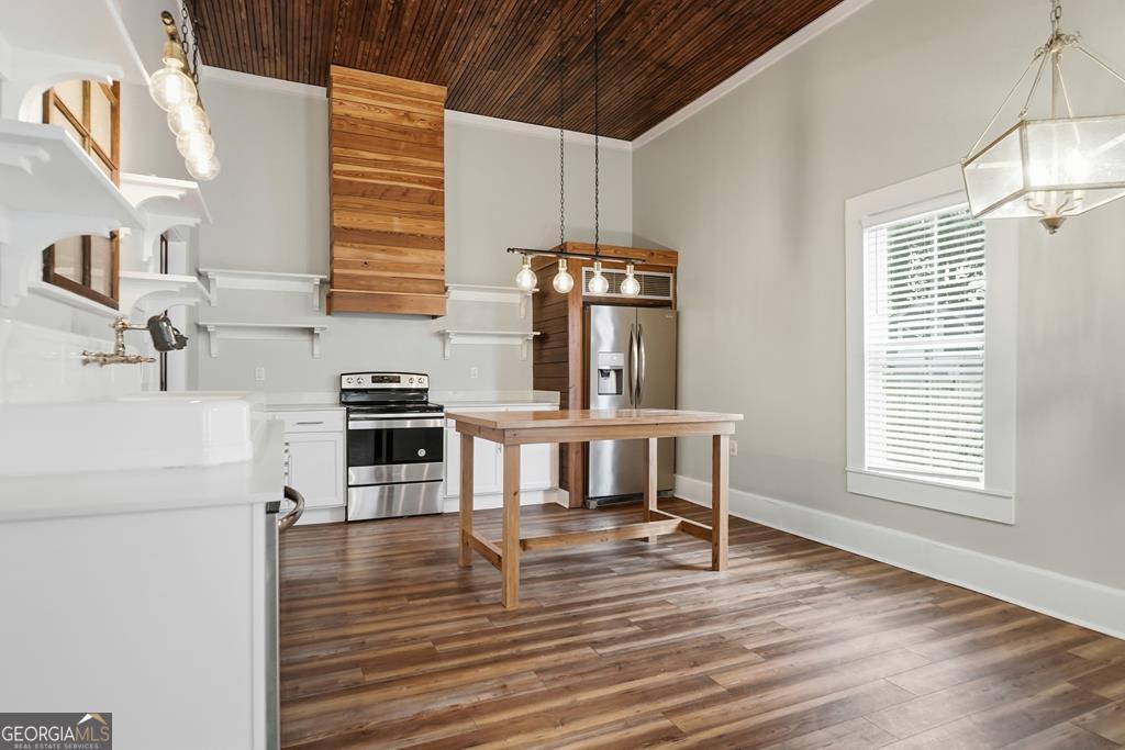 611 West 3rd Street Ocilla, GA 31774 - Photo 9 of 53 a view of kitchen and dining room with wooden floor