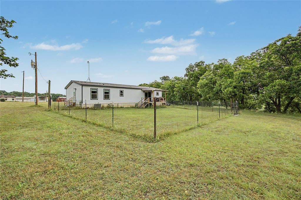 6065 Timber Trail Azle, TX 76020 - Photo 32 of 33 a house view with a play ground
