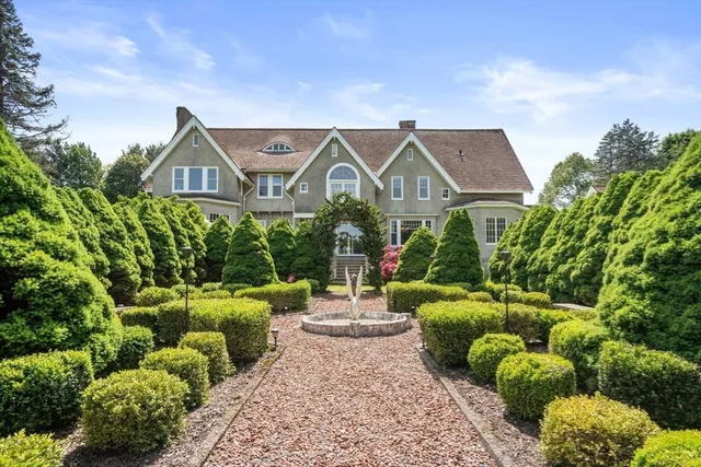a front view of a house with garden