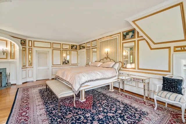 a spacious bedroom with a bed and a window