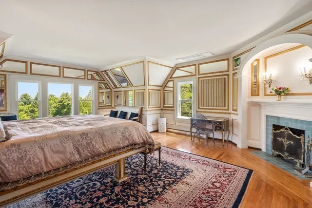 a bed room with a bed and a fireplace