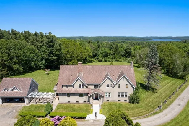 an aerial view of residential house with swimming pool
