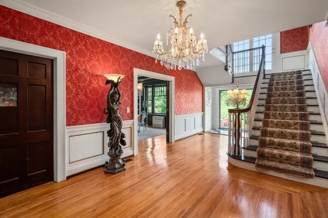 a view of a room with wooden floor and windows