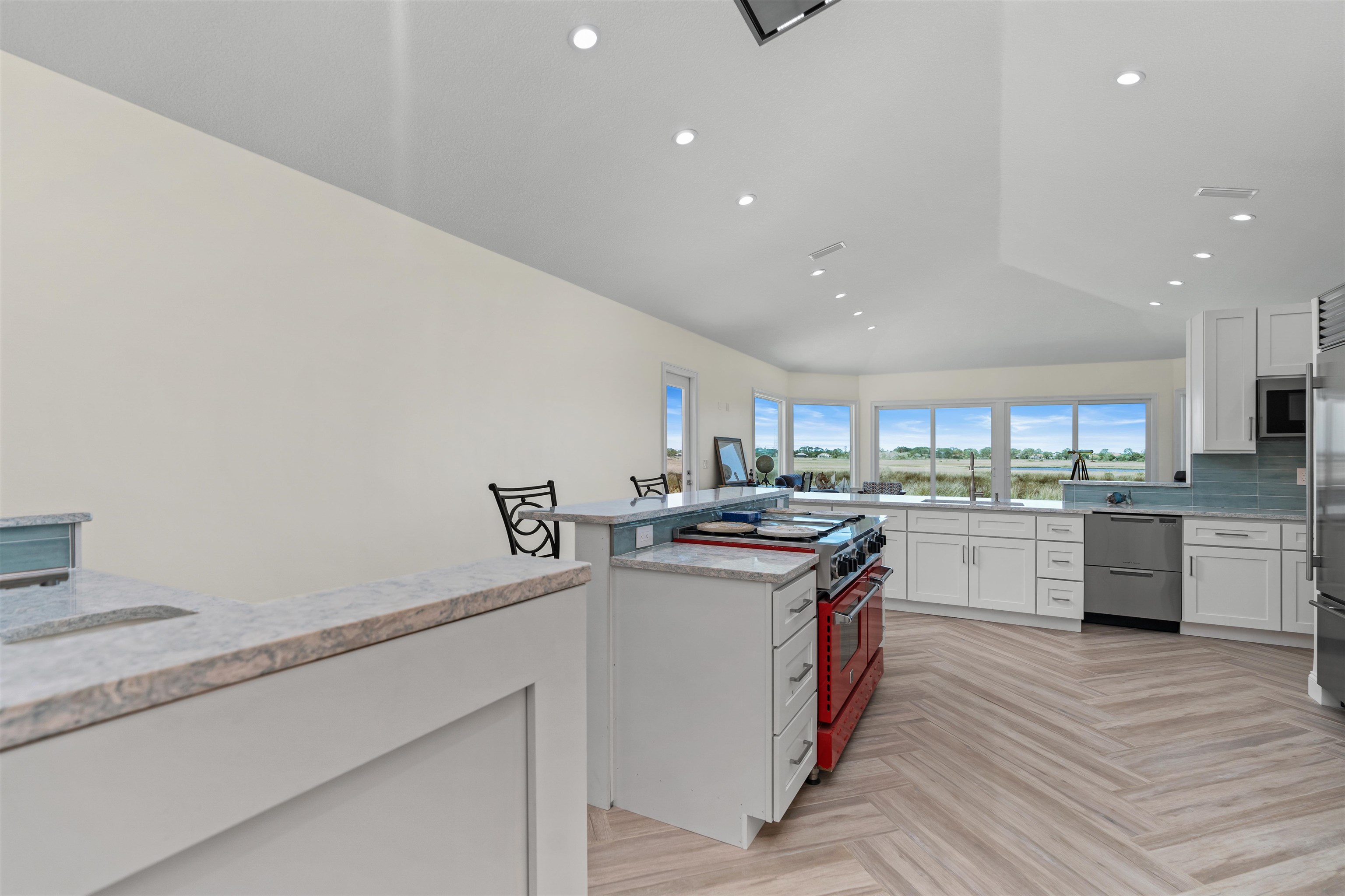 318 Marsh Point Circle St. Augustine, FL 32080 - Photo 12 of 44 a kitchen with stainless steel appliances granite countertop a stove and cabinets