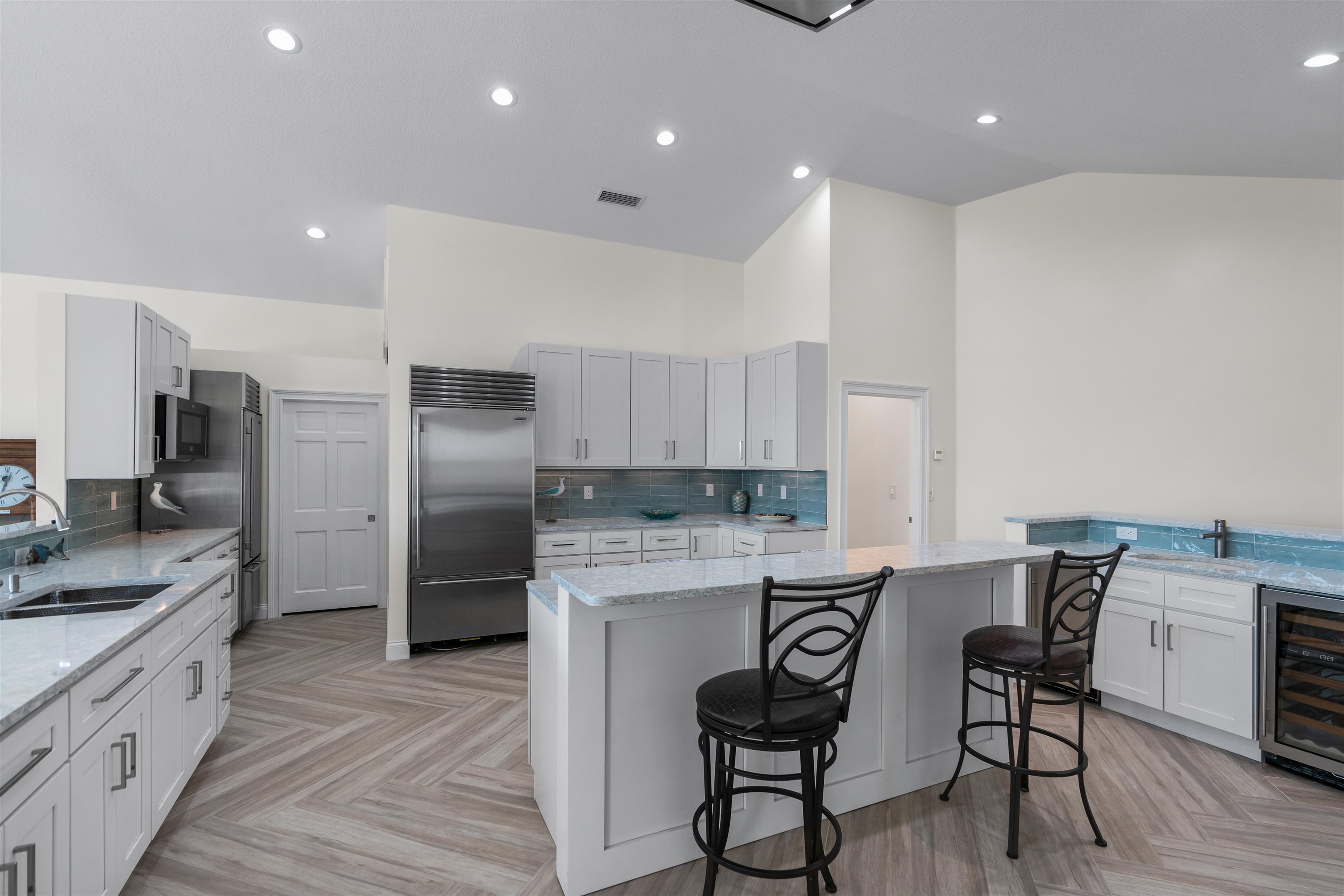 318 Marsh Point Circle St. Augustine, FL 32080 - Photo 16 of 44 a kitchen with stainless steel appliances granite countertop a table chairs sink and cabinets