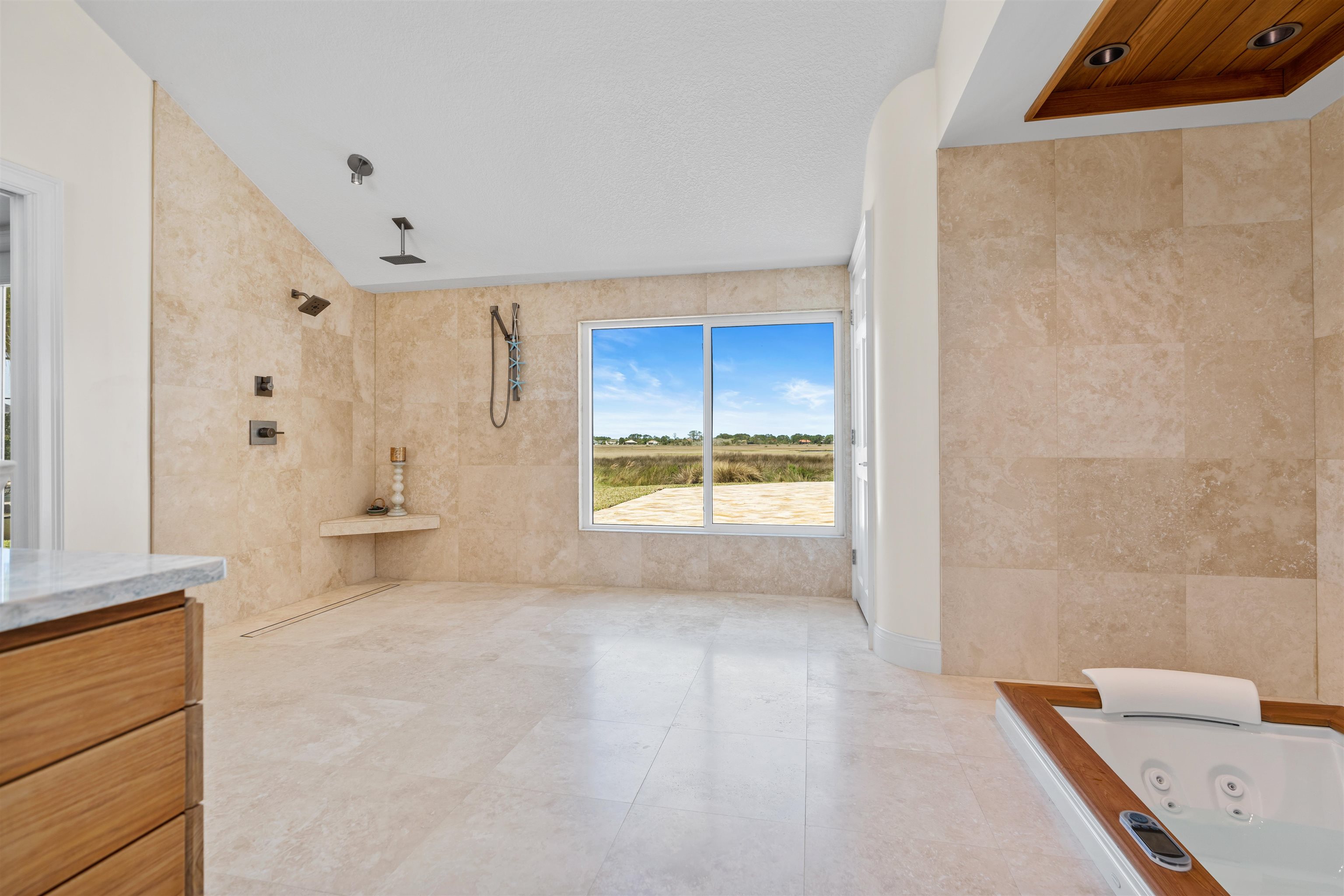318 Marsh Point Circle St. Augustine, FL 32080 - Photo 22 of 44 a bathroom with a bathtub and a shower