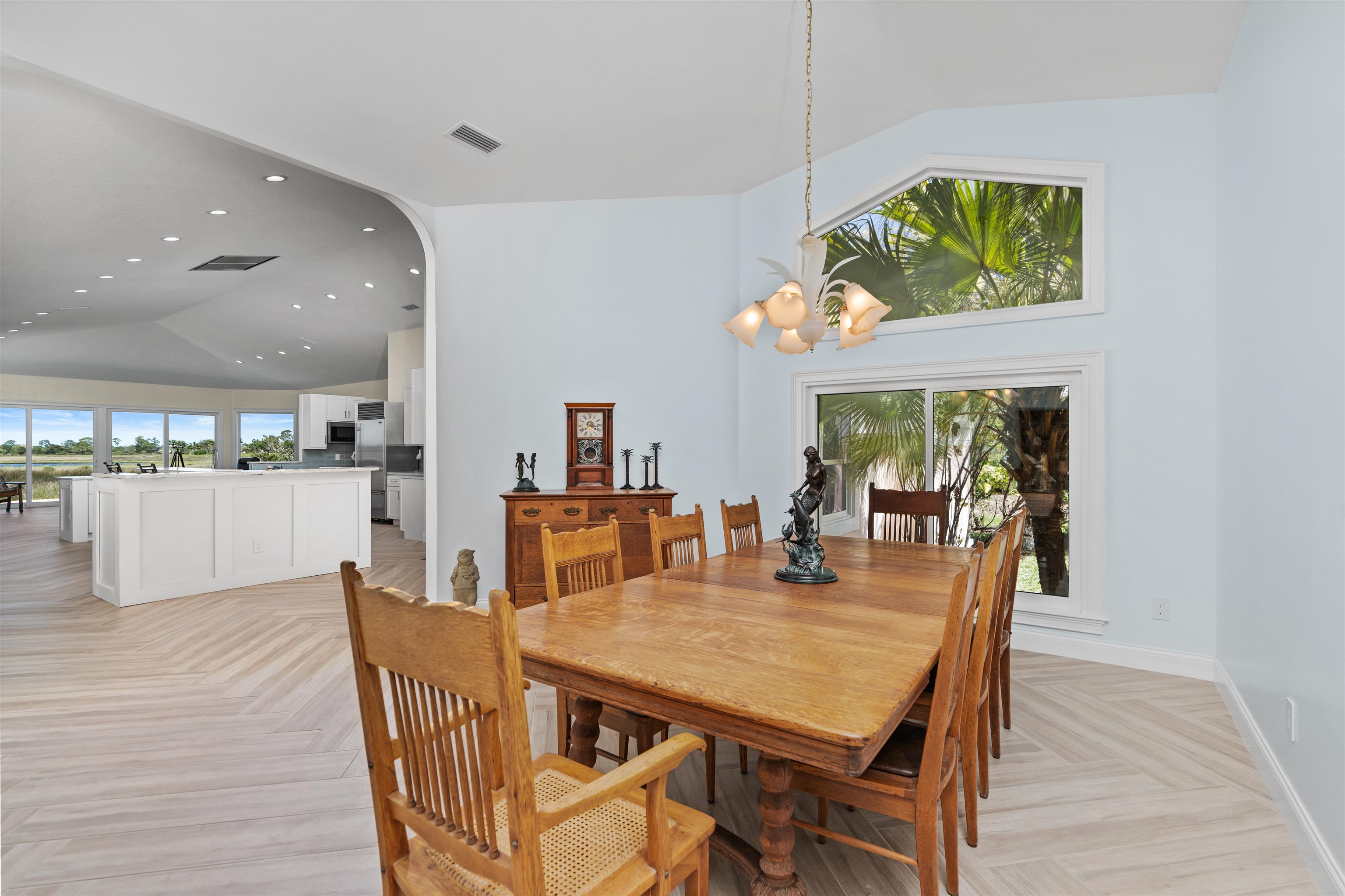 318 Marsh Point Circle St. Augustine, FL 32080 - Photo 9 of 44 a dining room with furniture a rug and wooden floor