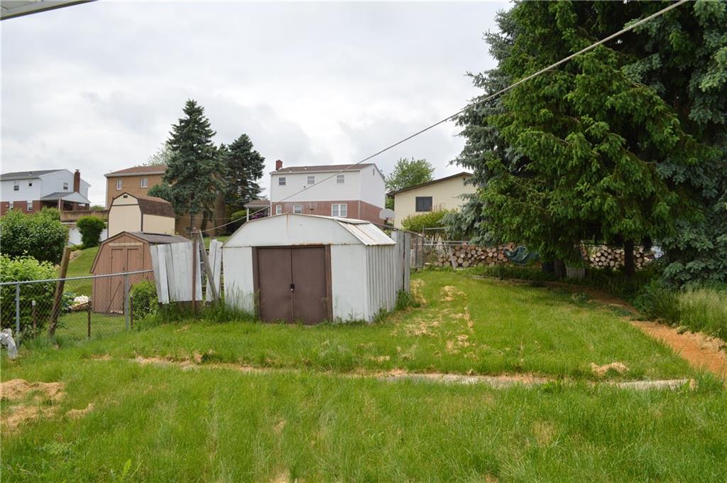 51 Gordon Street McKees Rocks, PA 15136 - Photo 6 of 6 a view of a house with a big yard and large trees