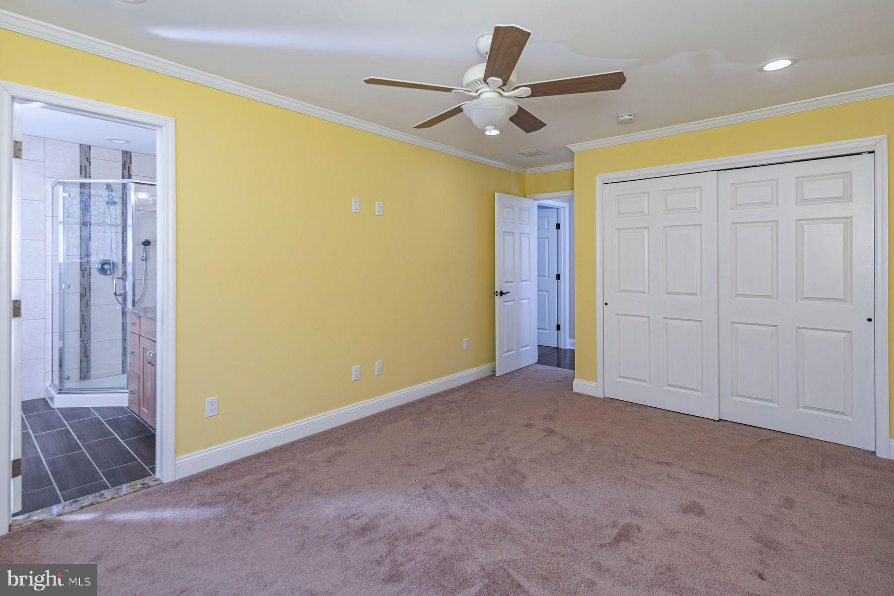 310 Hollow Road Skillman, NJ 08558 - Photo 23 of 32 a view of a livingroom with a ceiling fan & entryway