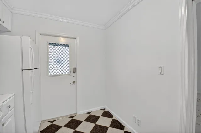 a view of a closet area with wooden floor