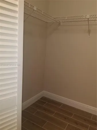 a view of a small space with racks on the wall