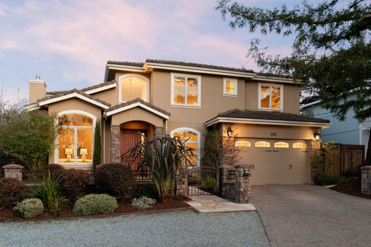 a front view of a house with a garage