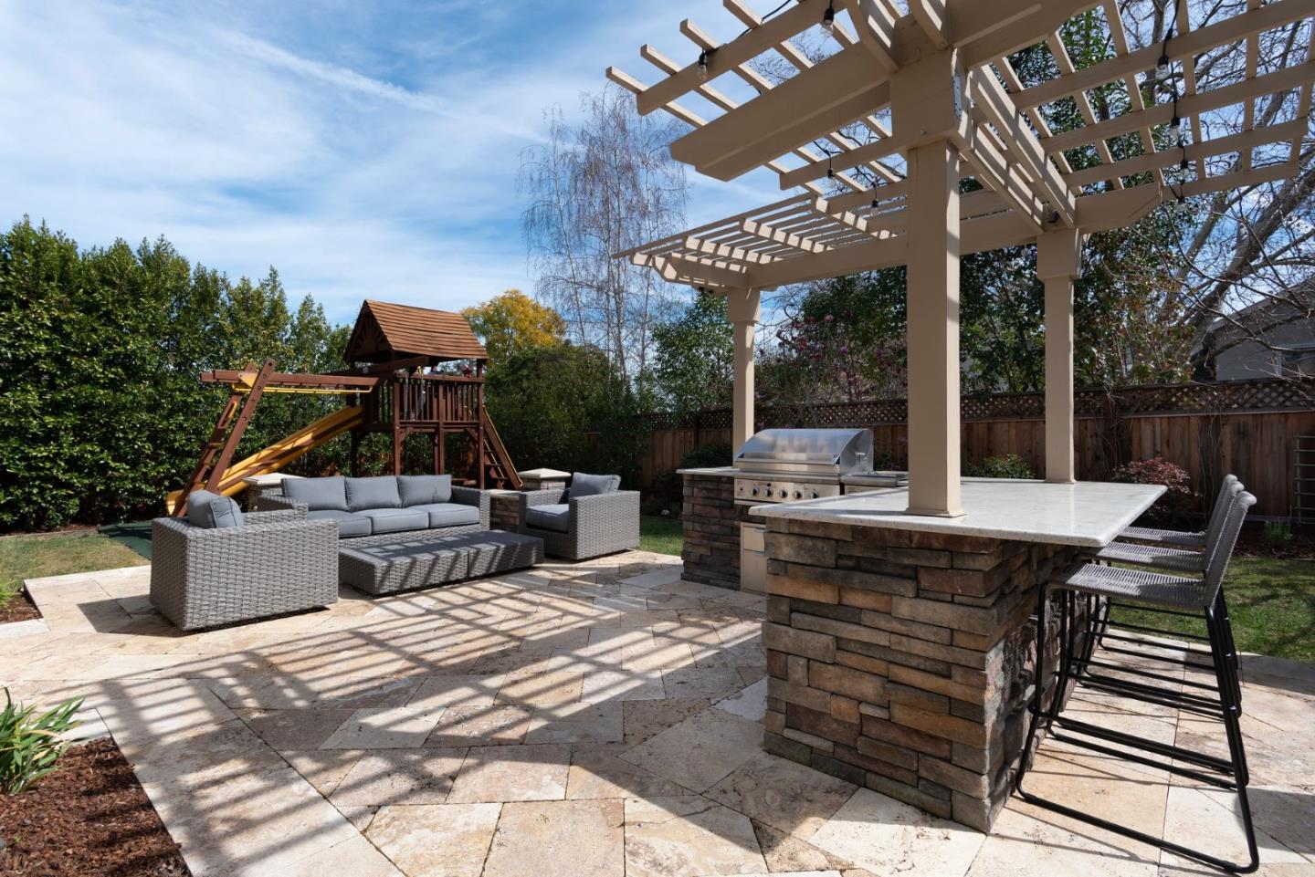 2181 Cedar Avenue Menlo Park, CA 94025 - Photo 14 of 16 a view of a patio with a dining table and chairs with wooden floor and fence