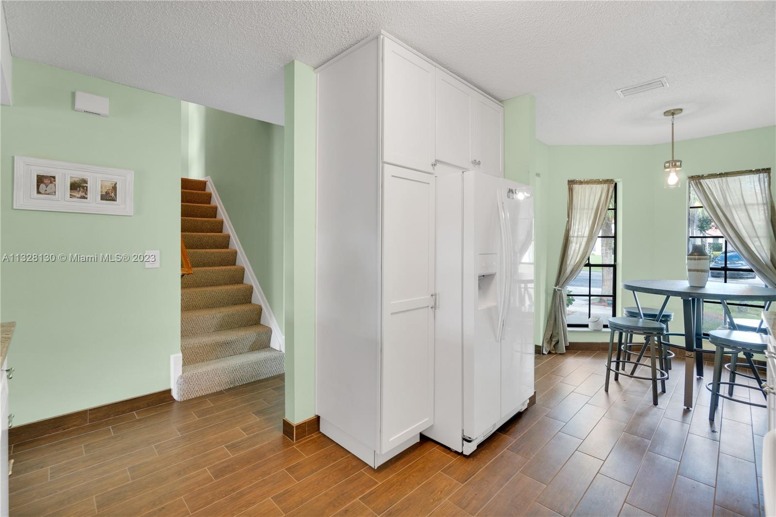 10274 Windswept Place Boca Raton, FL 33498 - Photo 14 of 33 a view of entryway and hall with wooden floor