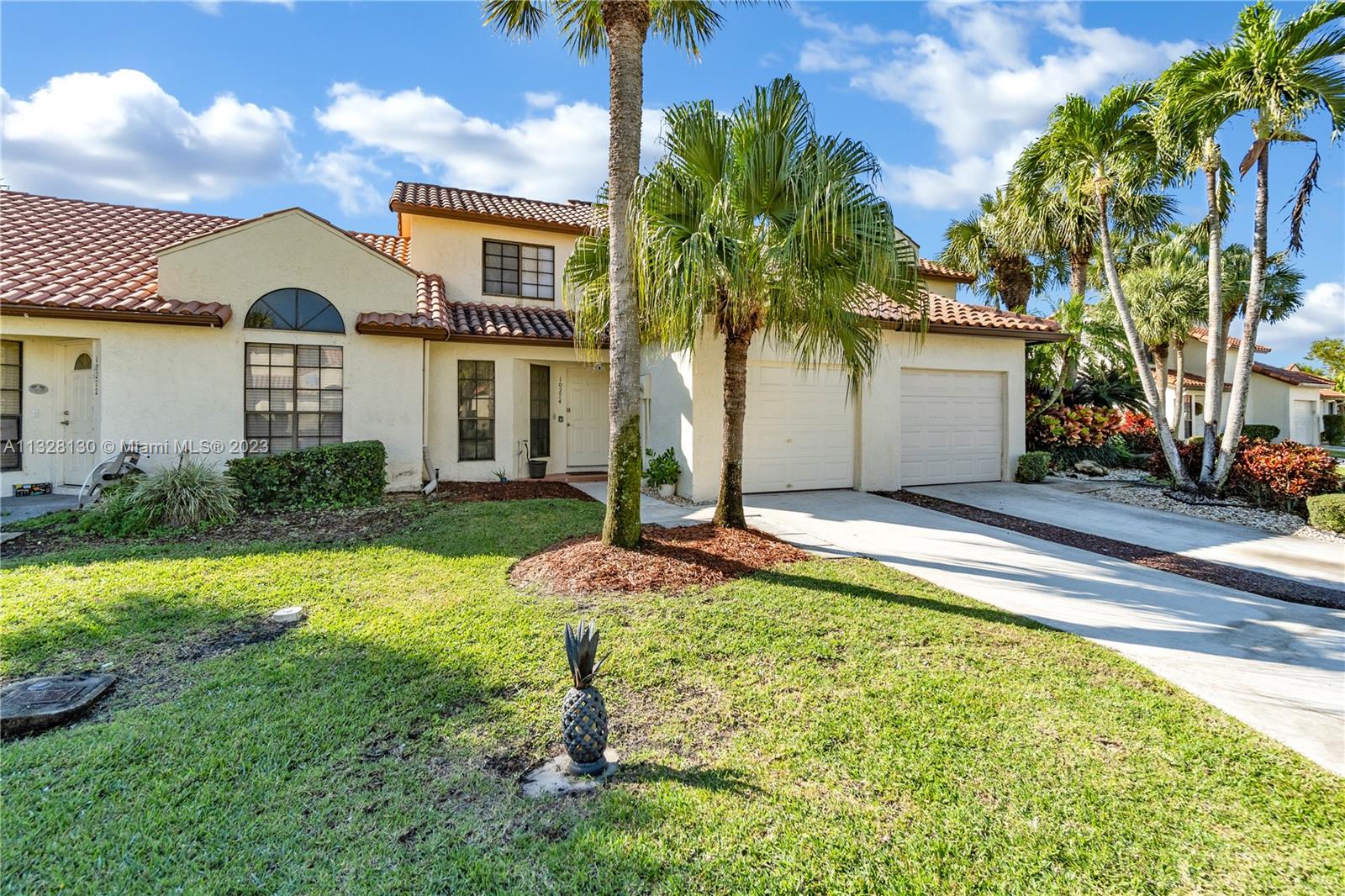 10274 Windswept Place Boca Raton, FL 33498 - Photo 22 of 33 a front view of a house with garden
