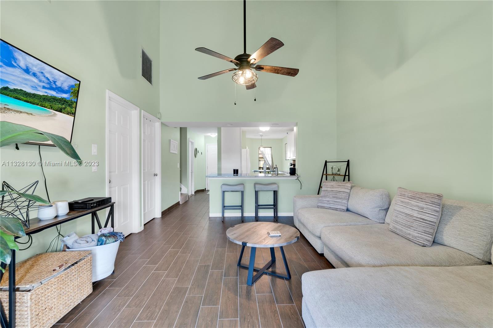 10274 Windswept Place Boca Raton, FL 33498 - Photo 9 of 33 a living room with furniture and a wooden floor