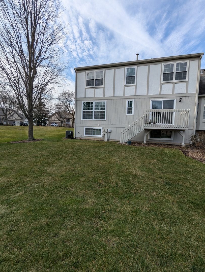 1466 Garnet Circle Hoffman Estates, IL 60192 - Photo 23 of 23 a view of a house with a yard