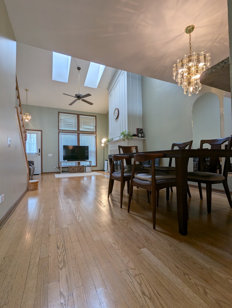1466 Garnet Circle Hoffman Estates, IL 60192 - Photo 7 of 23 a view of a dining room with furniture and wooden floor
