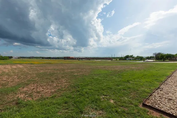 a view of a water with a big yard