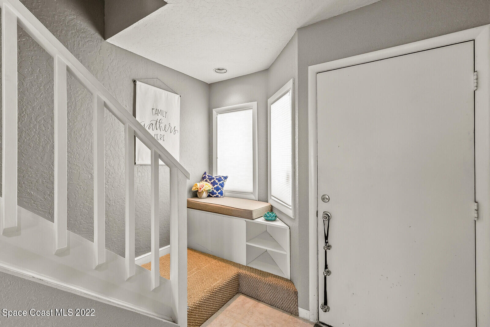 1784 Quail Trail Melbourne, FL 32935 - Photo 12 of 40 a view of entryway and hall with wooden floor