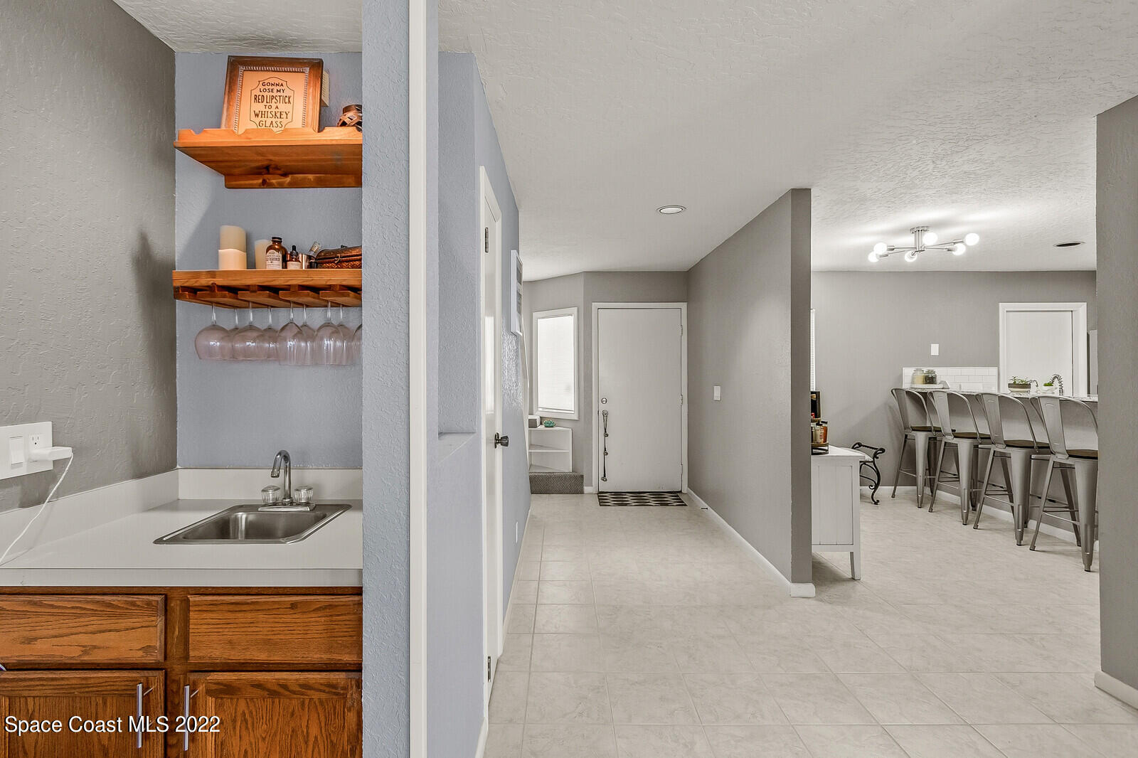 1784 Quail Trail Melbourne, FL 32935 - Photo 18 of 40 a bathroom with a sink and a mirror