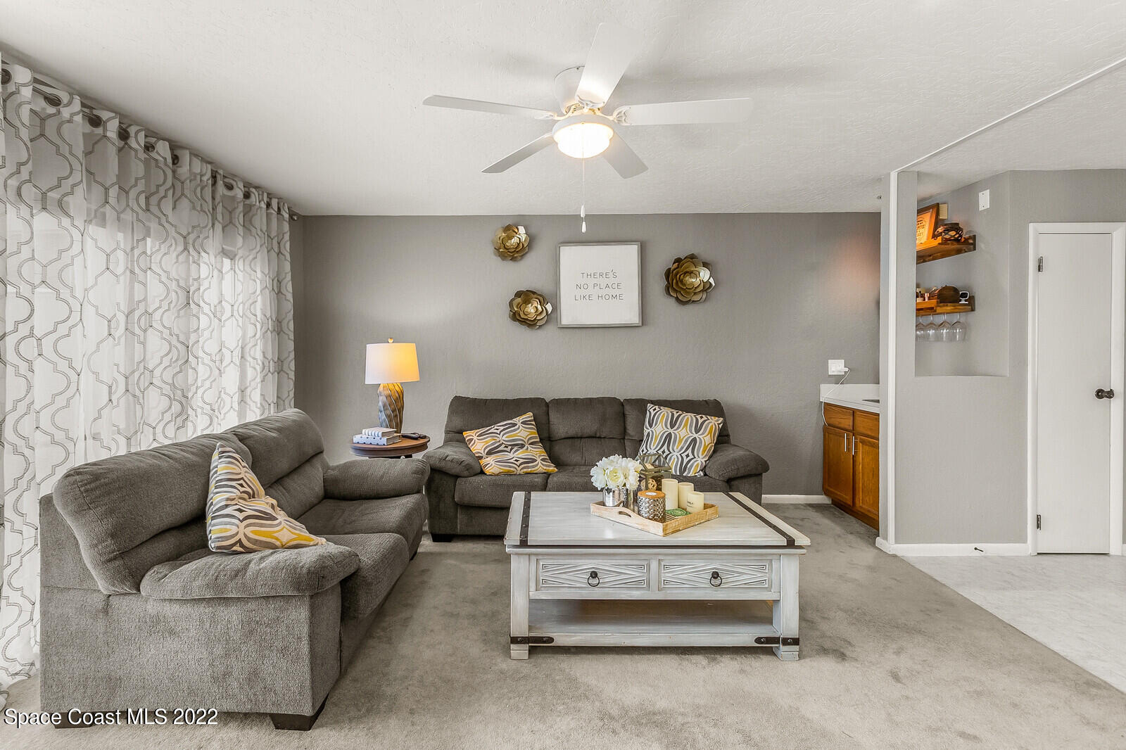 1784 Quail Trail Melbourne, FL 32935 - Photo 20 of 40 a living room with furniture and a table