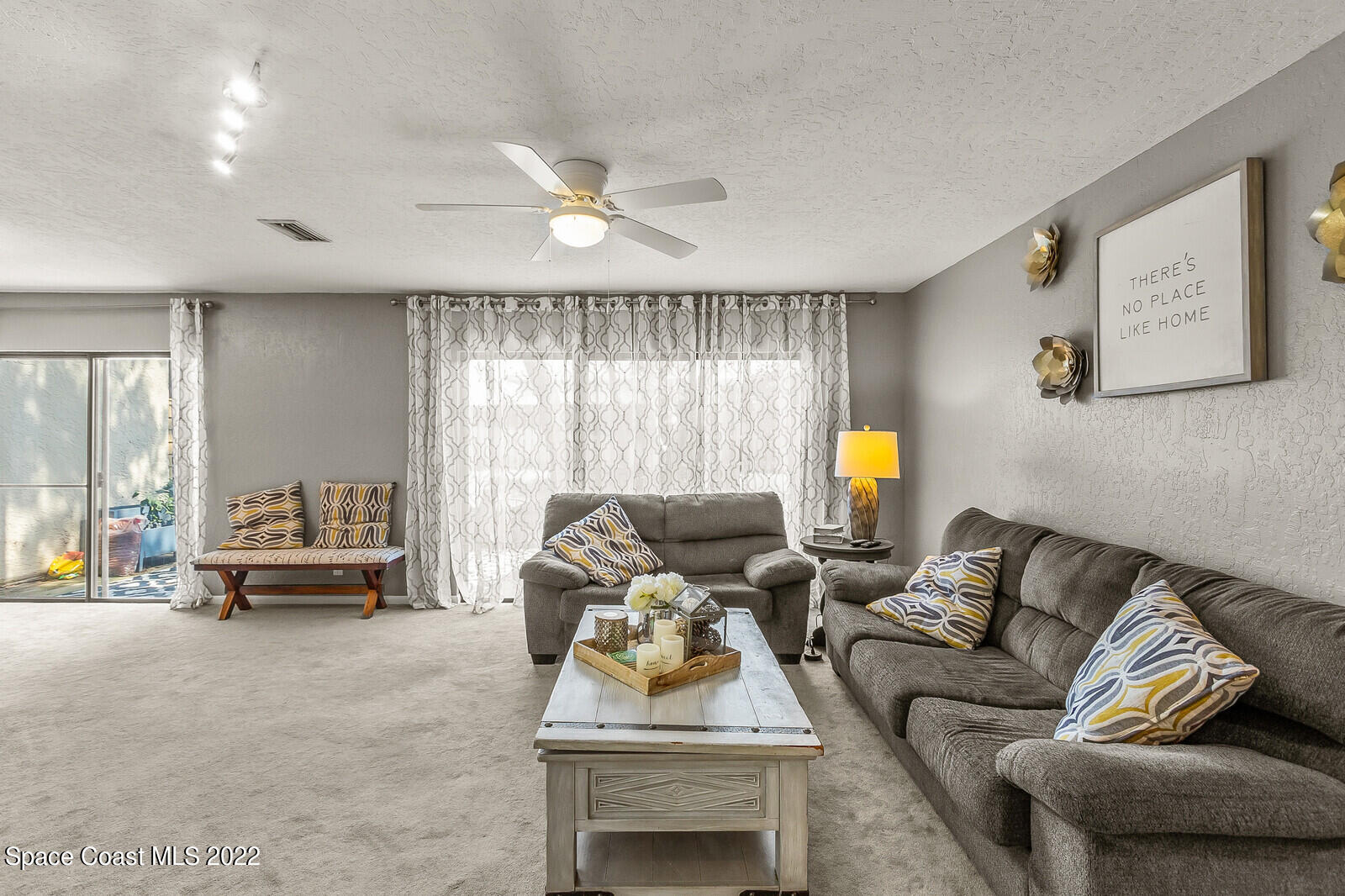 1784 Quail Trail Melbourne, FL 32935 - Photo 21 of 40 a living room with furniture and a large window
