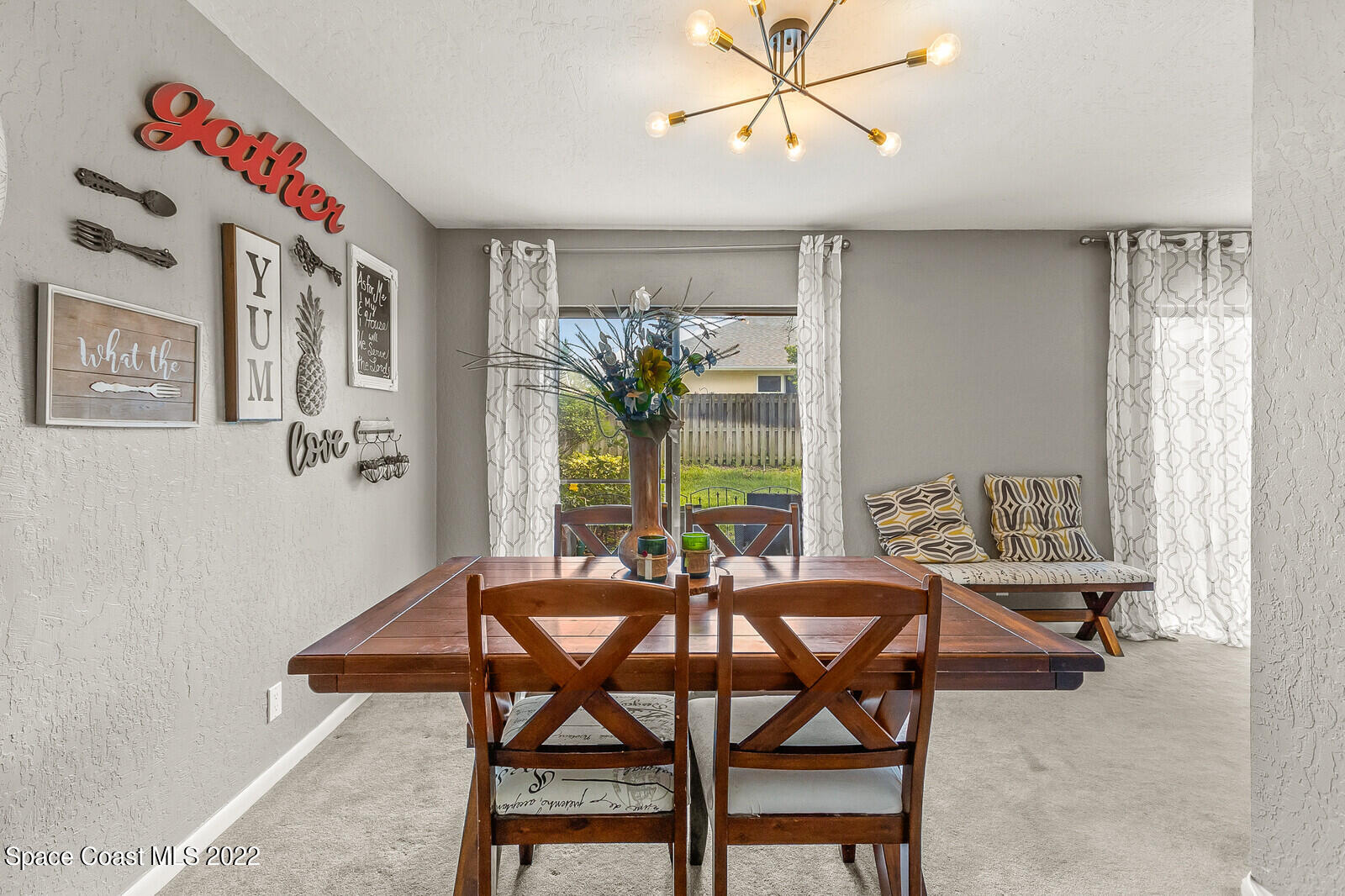 1784 Quail Trail Melbourne, FL 32935 - Photo 22 of 40 a dining room with furniture and window