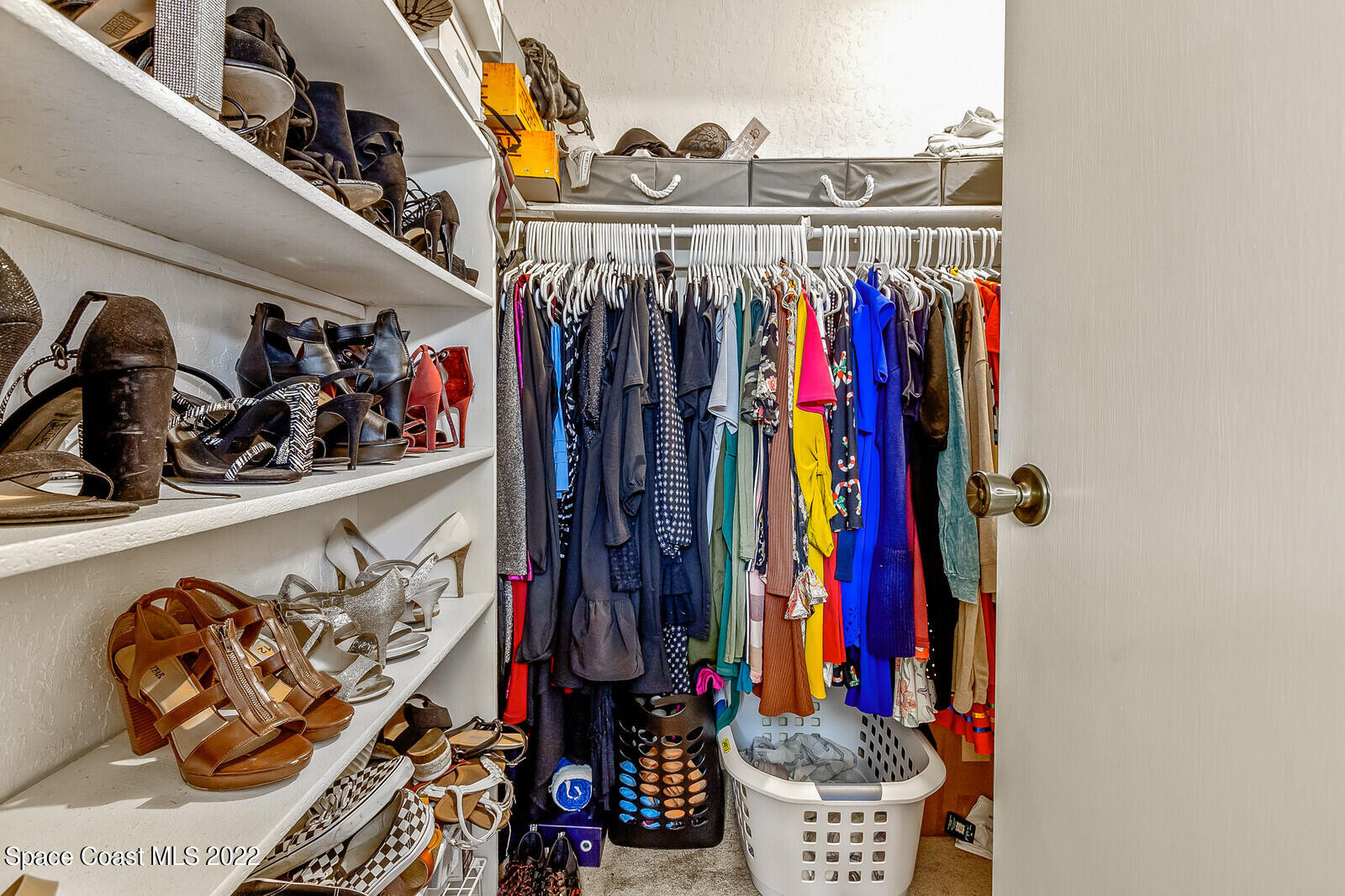 1784 Quail Trail Melbourne, FL 32935 - Photo 29 of 40 a view of walk in closet with clothes