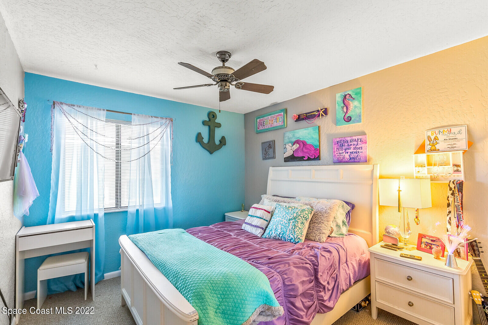 1784 Quail Trail Melbourne, FL 32935 - Photo 30 of 40 a bedroom with a bed and a window