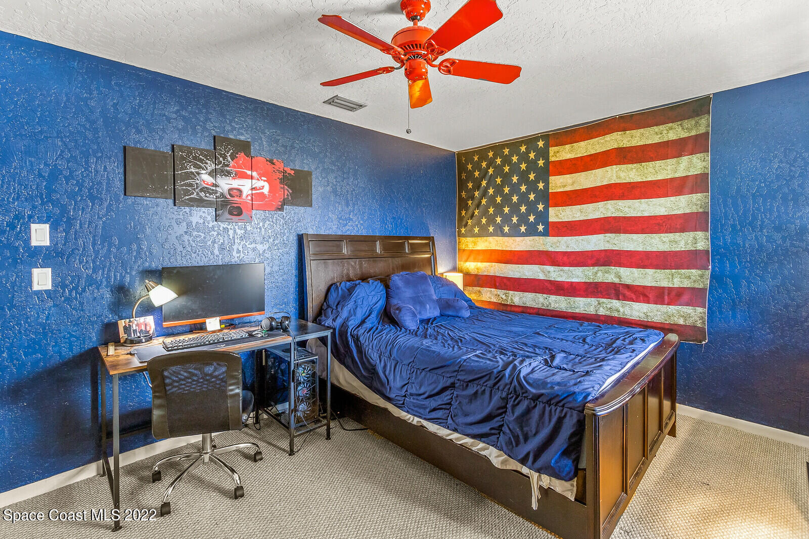 1784 Quail Trail Melbourne, FL 32935 - Photo 31 of 40 a bed room with a bed and a fish tank