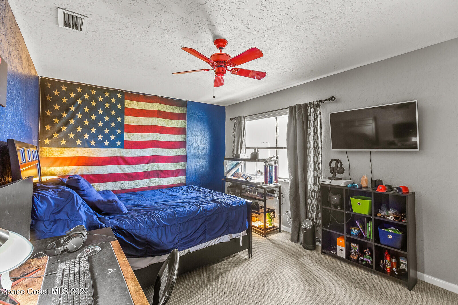 1784 Quail Trail Melbourne, FL 32935 - Photo 32 of 40 a living room with furniture and a flat screen tv