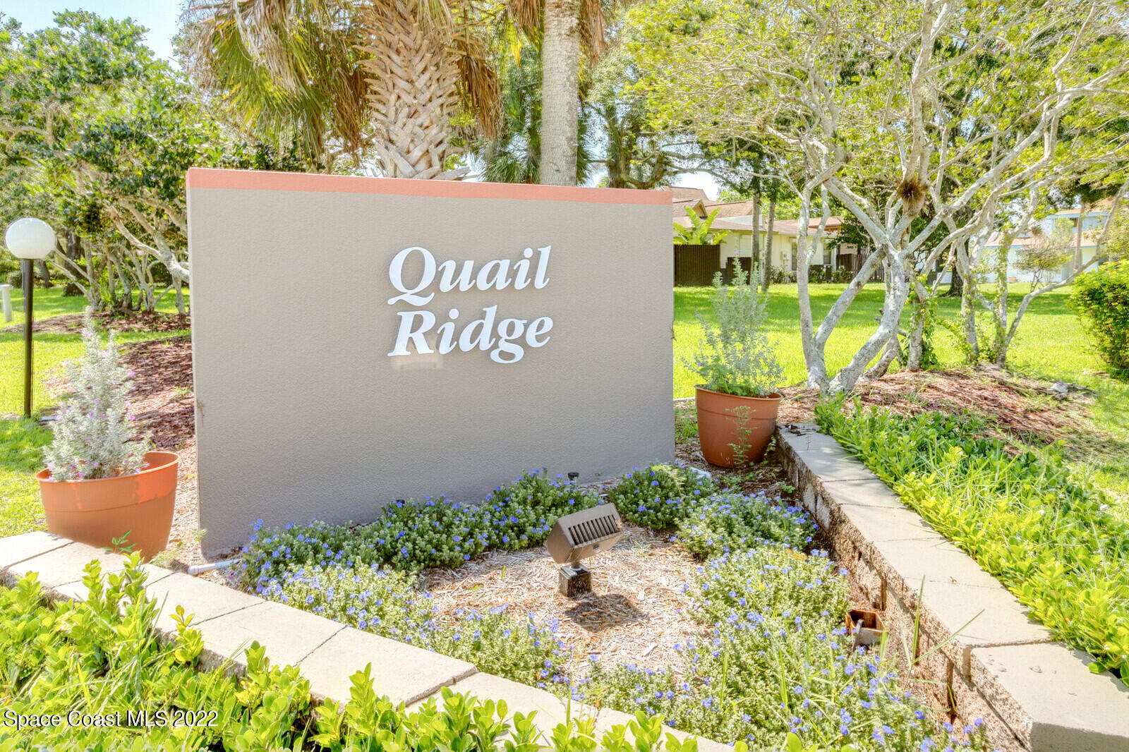 1784 Quail Trail Melbourne, FL 32935 - Photo 35 of 40 a sign on the side of a building