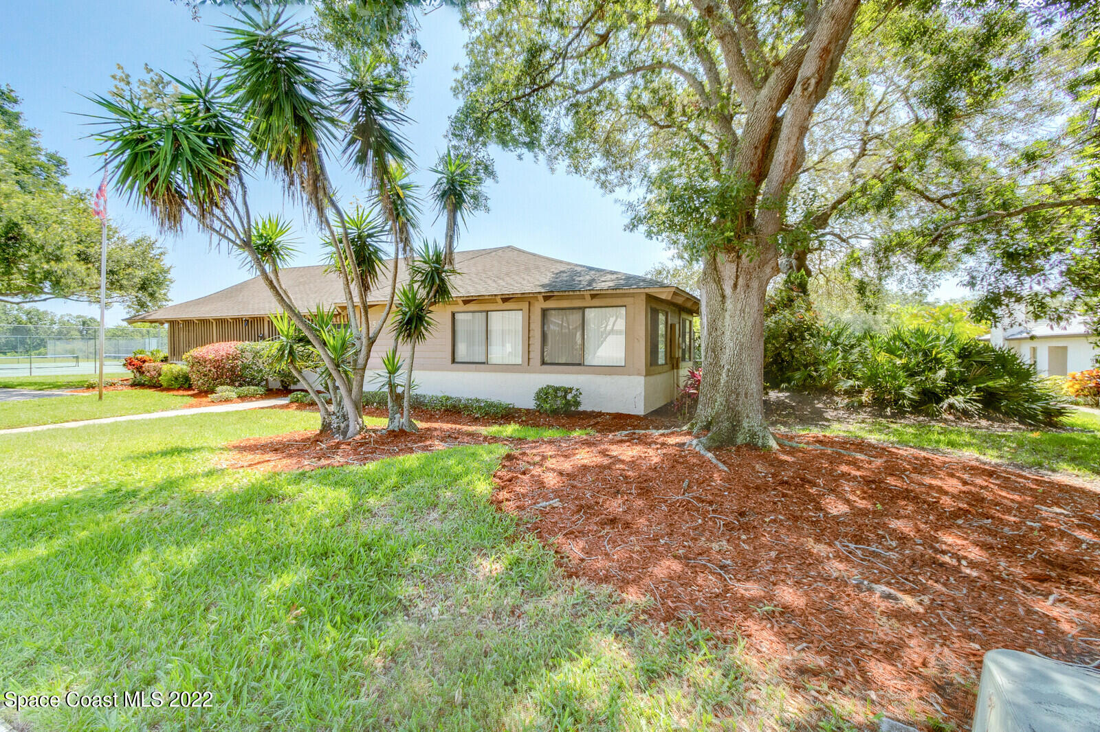 1784 Quail Trail Melbourne, FL 32935 - Photo 36 of 40 a front view of a house with yard and green space