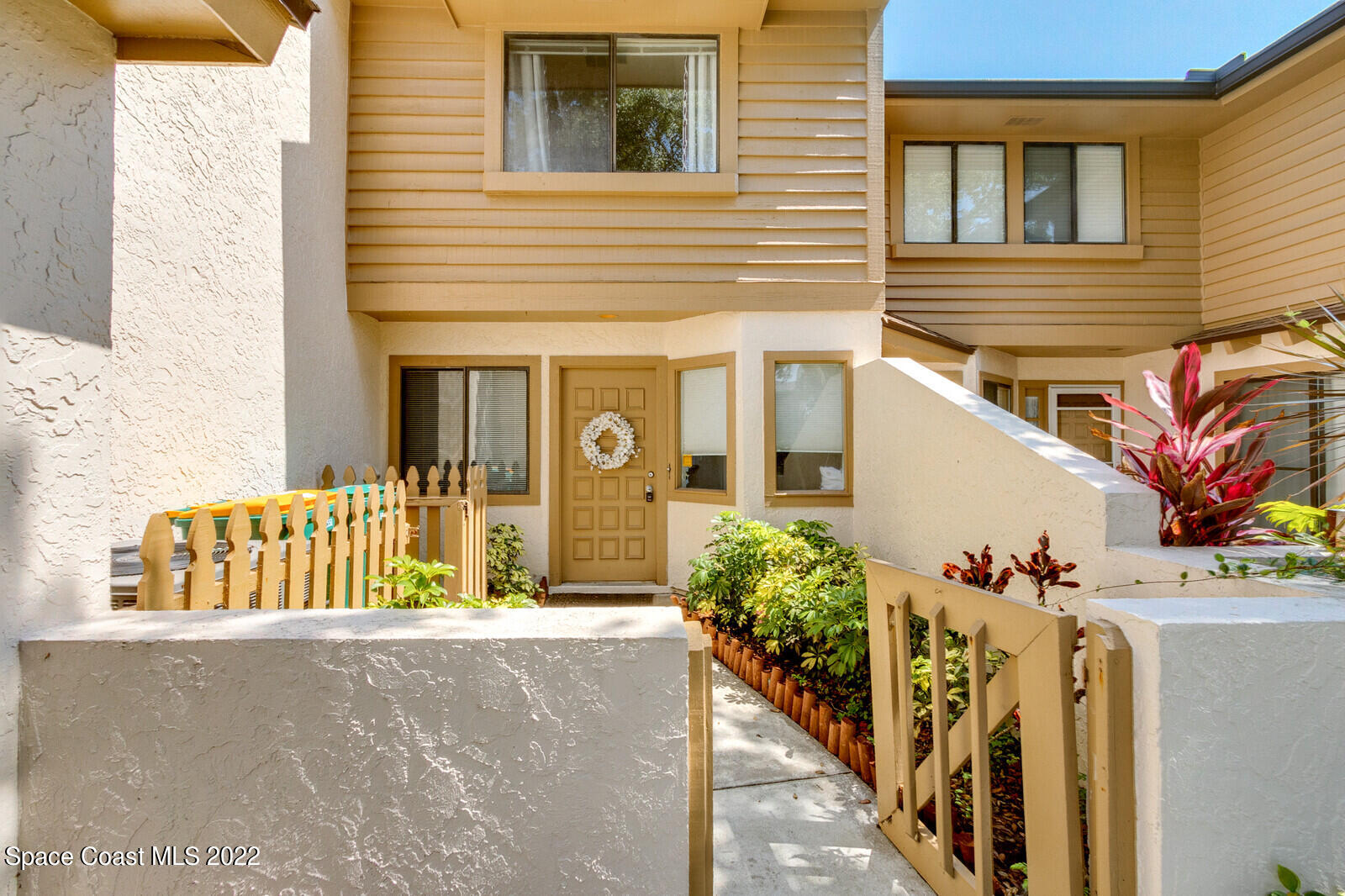 1784 Quail Trail Melbourne, FL 32935 - Photo 4 of 40 a view of potted plants with large windows