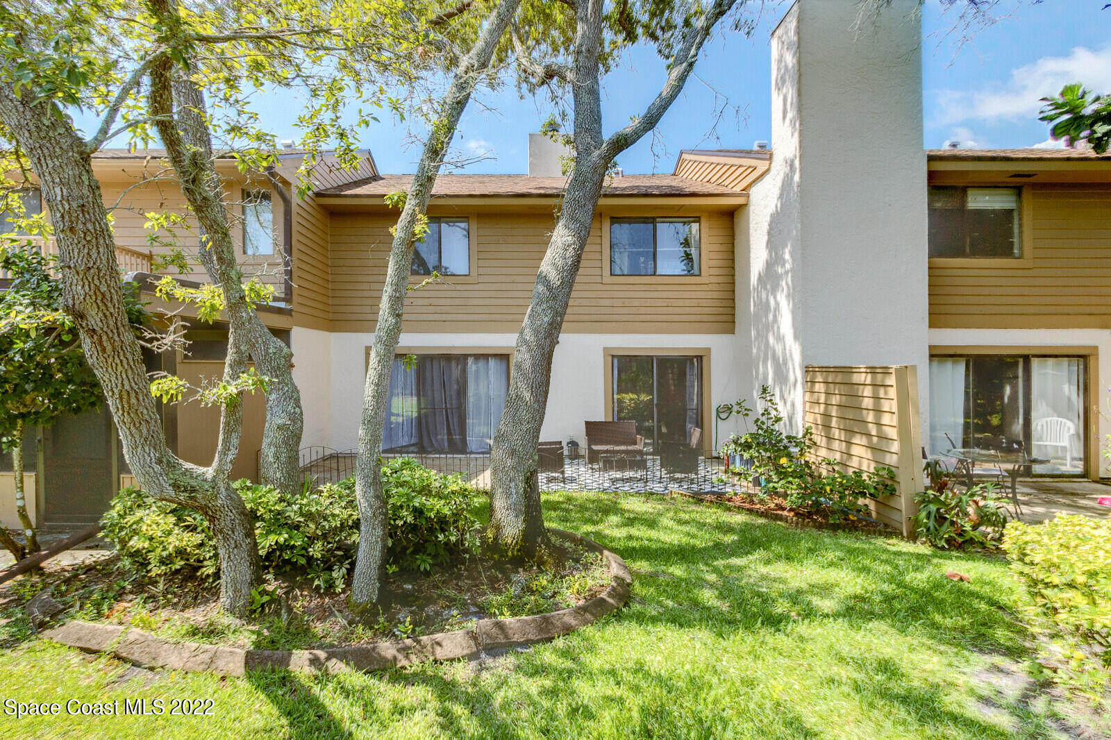 1784 Quail Trail Melbourne, FL 32935 - Photo 5 of 40 a front view of a house with garden