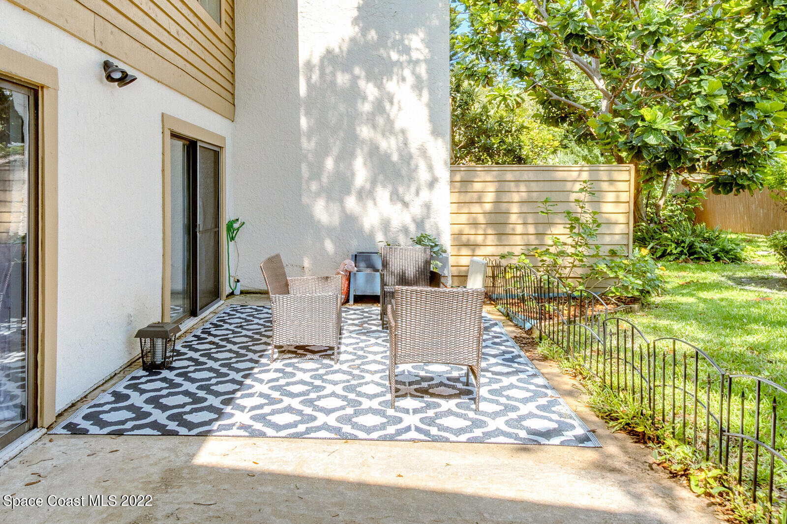 1784 Quail Trail Melbourne, FL 32935 - Photo 10 of 40 a view of a porch with furniture and garden