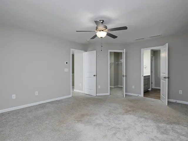 a view of empty room with fan