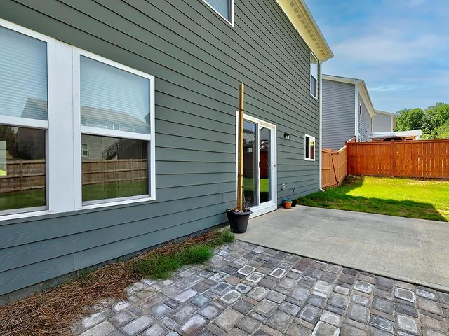 a view of a backyard of the house