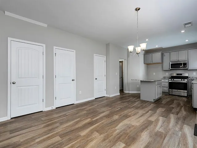 a view of a kitchen with microwave and cabinets