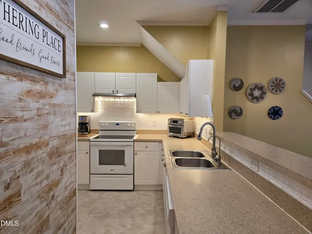 a kitchen with a stove and a sink