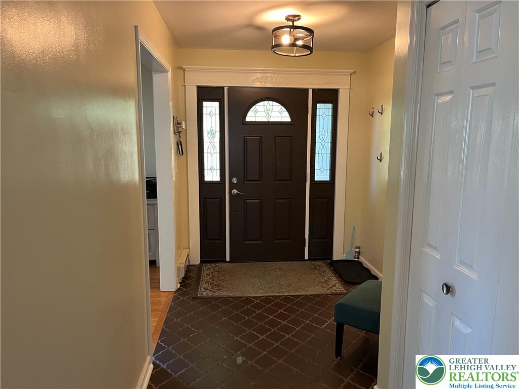6221 Dove Drive Bethlehem, PA 18017 - Photo 8 of 38 An inviting entrance foyer welcomes guests with classic detailing and durable tile flooring.