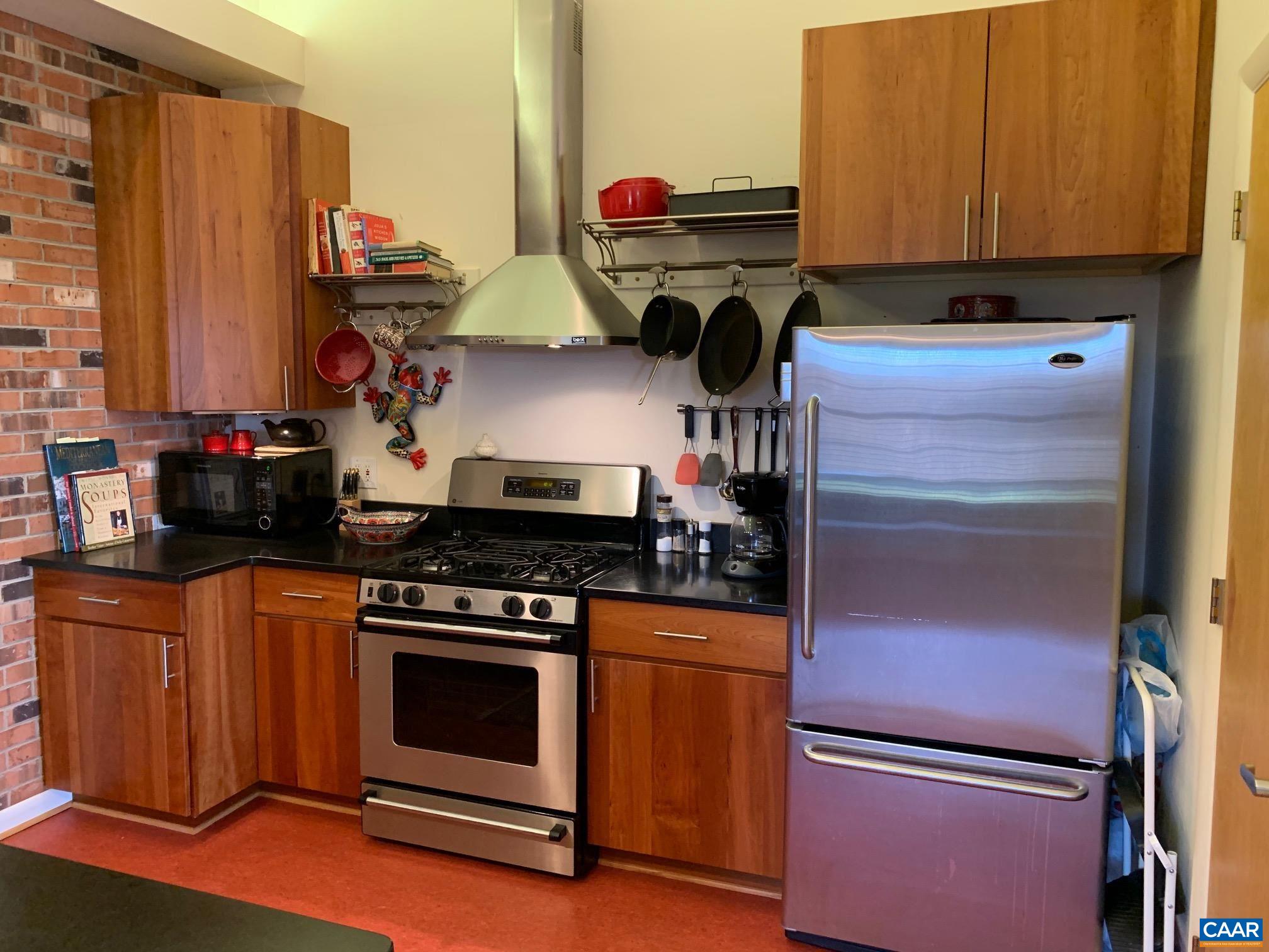 5305 Hoover Road Reva, VA 22735 - Photo 12 of 46 a kitchen with stainless steel appliances a stove and a refrigerator
