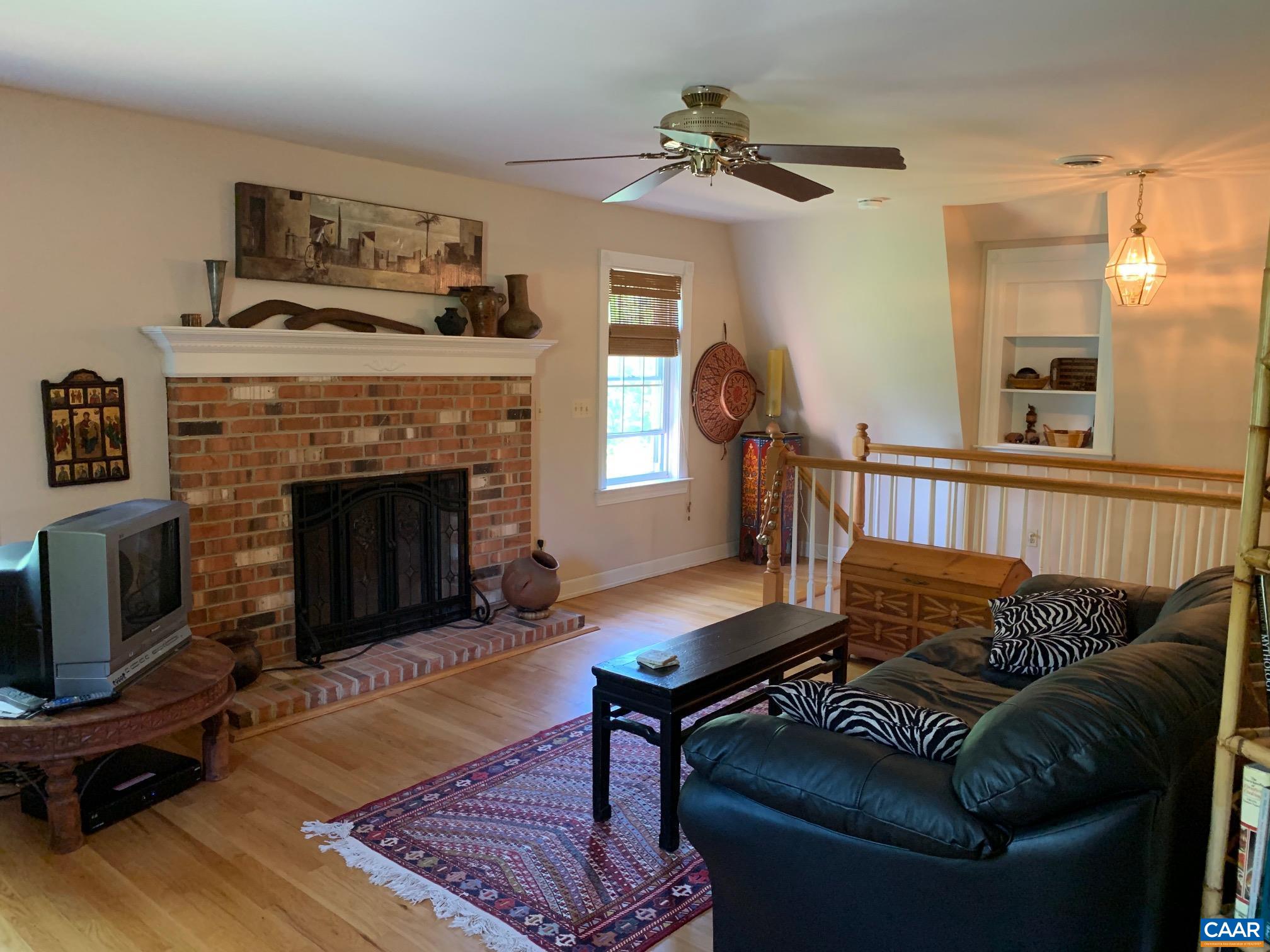 5305 Hoover Road Reva, VA 22735 - Photo 23 of 46 a living room with furniture and a fireplace
