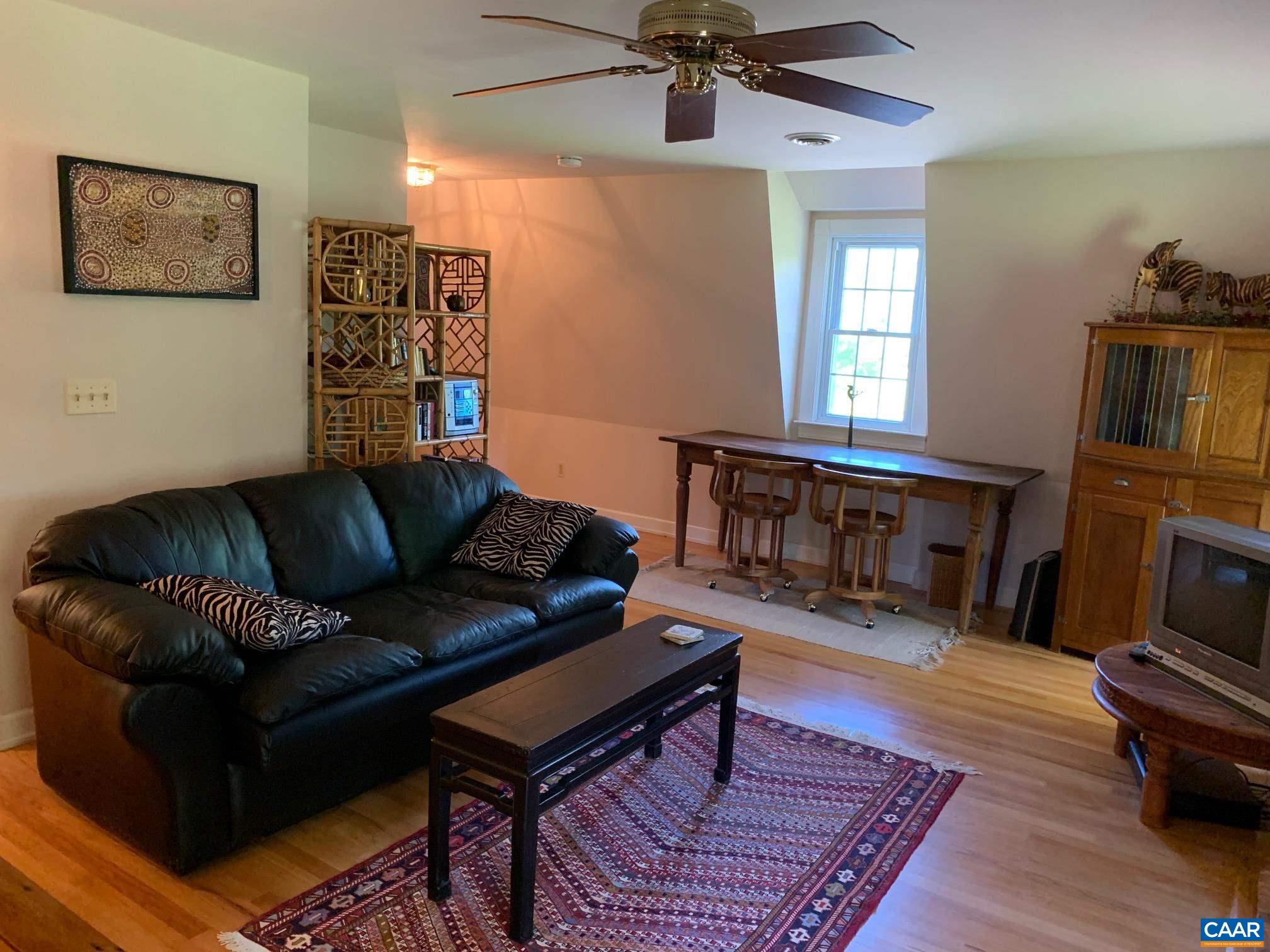 5305 Hoover Road Reva, VA 22735 - Photo 24 of 46 a living room with furniture and a fireplace