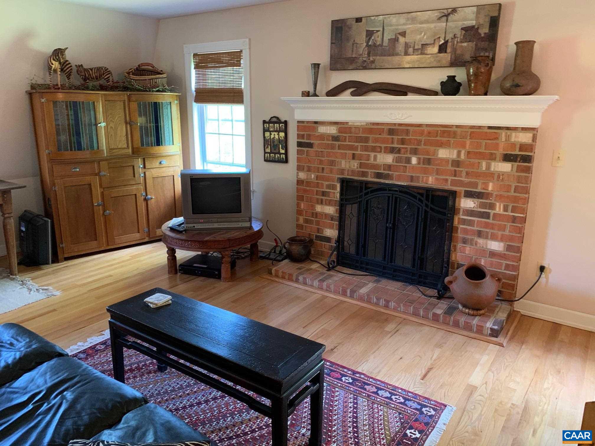 5305 Hoover Road Reva, VA 22735 - Photo 25 of 46 a living room with furniture and a fireplace
