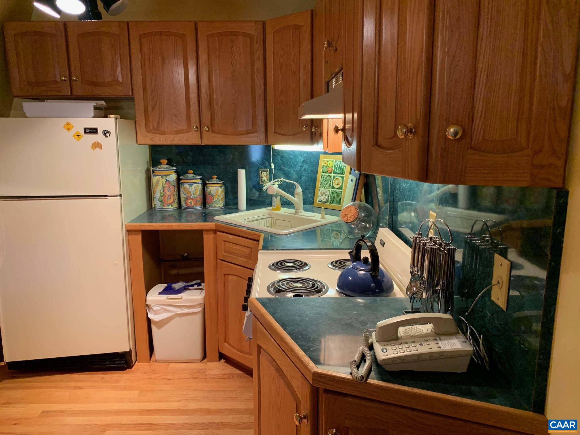 5305 Hoover Road Reva, VA 22735 - Photo 27 of 46 a kitchen with stainless steel appliances granite countertop a refrigerator a stove and a cabinets