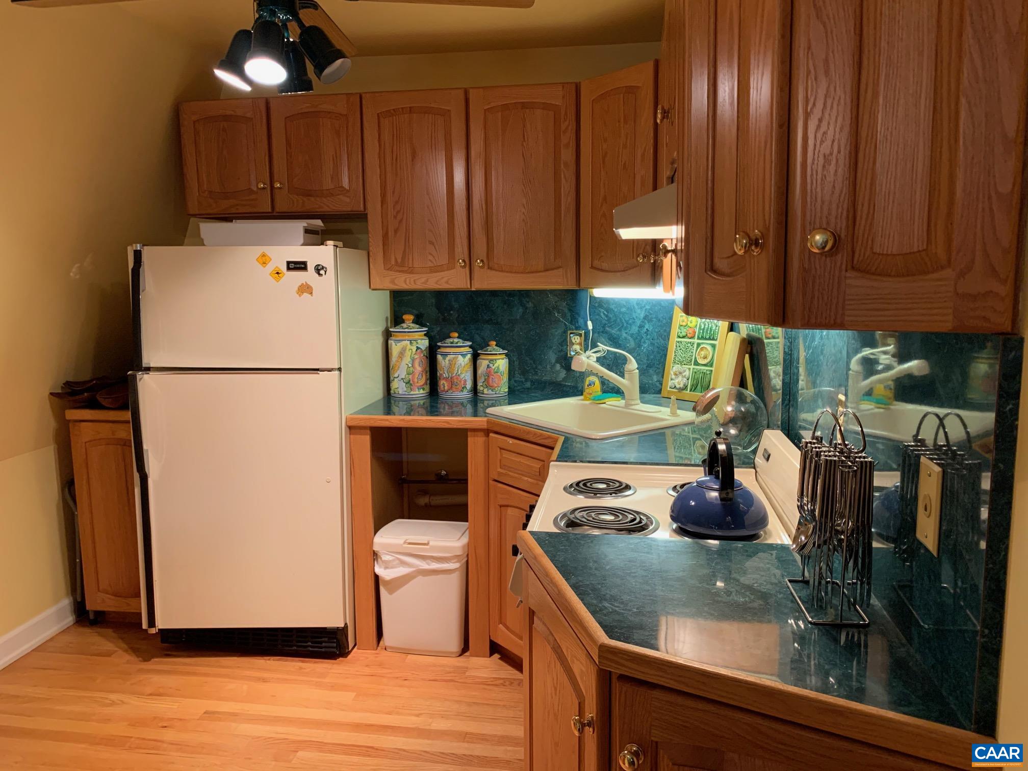 5305 Hoover Road Reva, VA 22735 - Photo 29 of 46 a kitchen with a refrigerator and a stove top oven